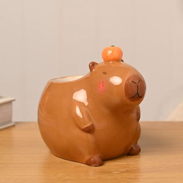 The Feel Good Club Capybara Ceramic Tabletop Plant Pot in Brown and Orange – 1