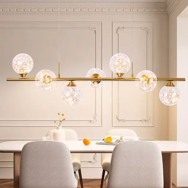 NIVOR 7 Light Dimmable LED Linear Pendant Light in Metallic Gold with Transparent Glass – 1