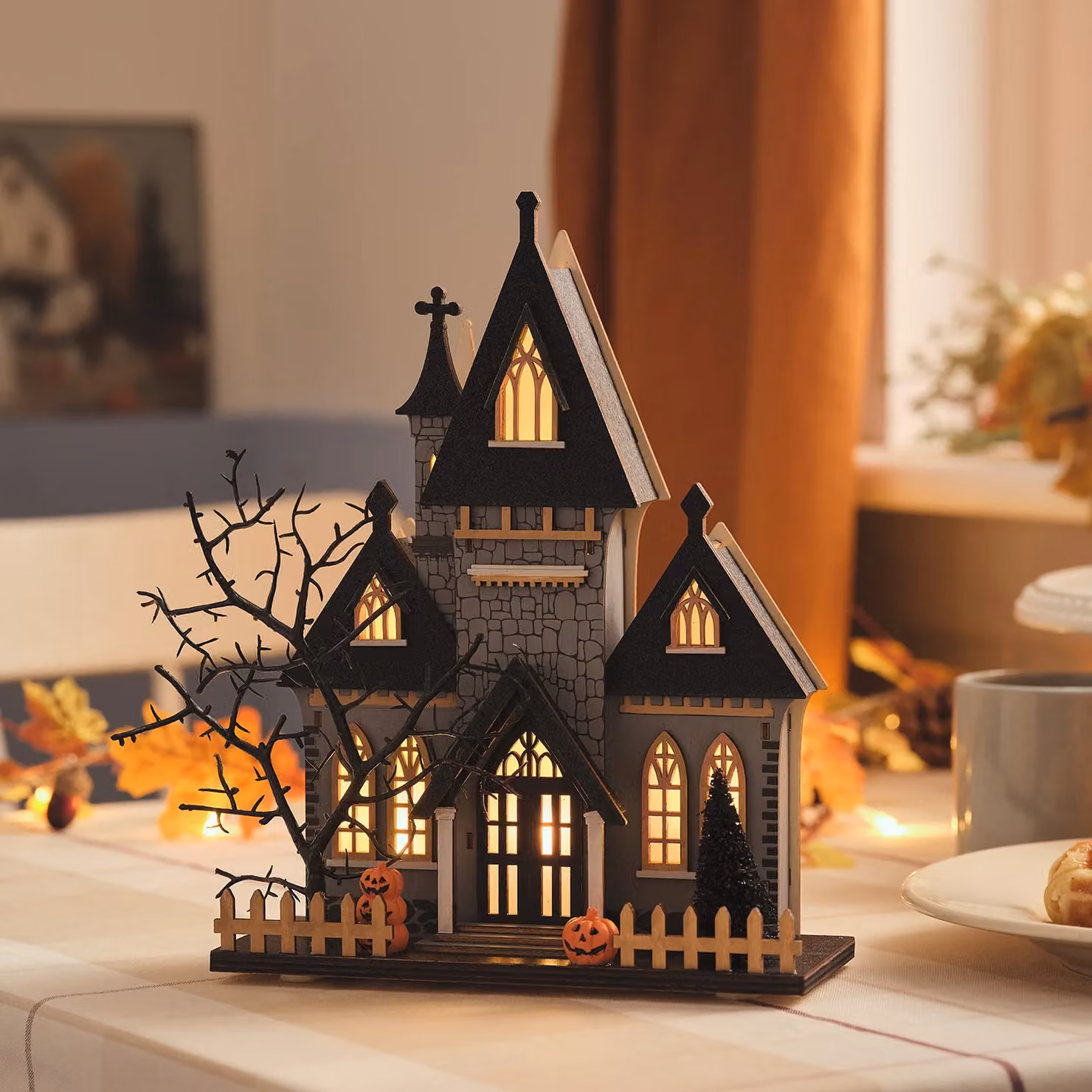 Lights4fun Spooky LED Wooden Halloween House Decoration in White and Multicolour