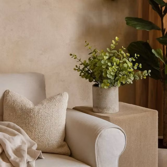 Wyld Haus Small Artificial Button Eucalyptus in a Green Ceramic Effect Pot with Grey Accents