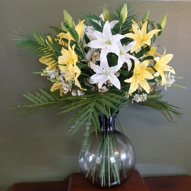 Artificial Lily Palm Leaf Flowers in a Multicolour Round Glass Ball Vase