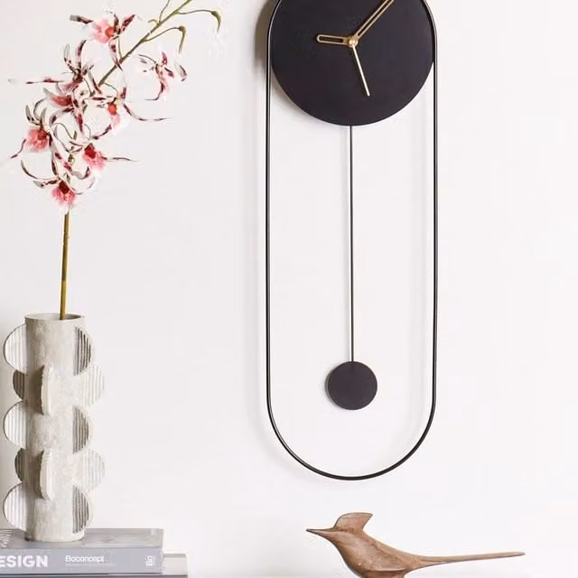 Wyld and Coco Oval Analog Wall Clock in Black and Gold Metal with Pendulum, W/H: 62 x 20 cm – 1