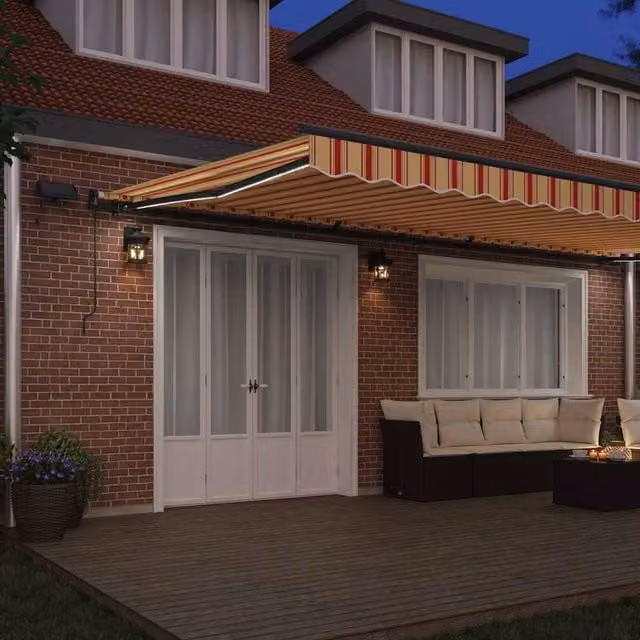 Berkfield Home Manual Retractable Folding Arm Awning with LED, Yellow and Orange Striped Polyester, W: 600 cm, D: 300 cm – 1