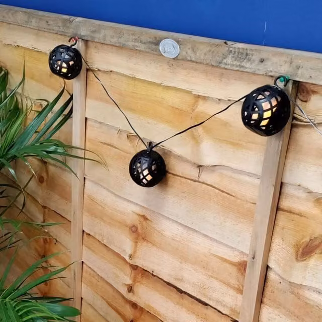 Premier 10 Flickering Flame Lantern String Lights in Black