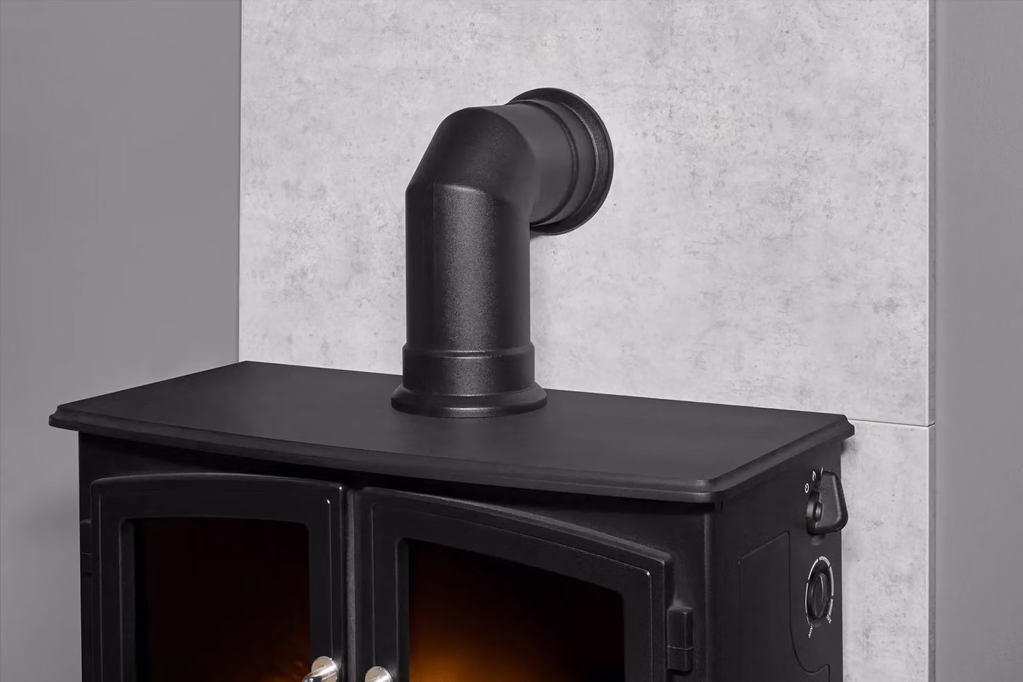 Acantha Fires & Fireplaces Woodhouse Electric Wall Mounted Stove with Tile and Hearth Set in Black Concrete Effect and Angled Pipe – 3