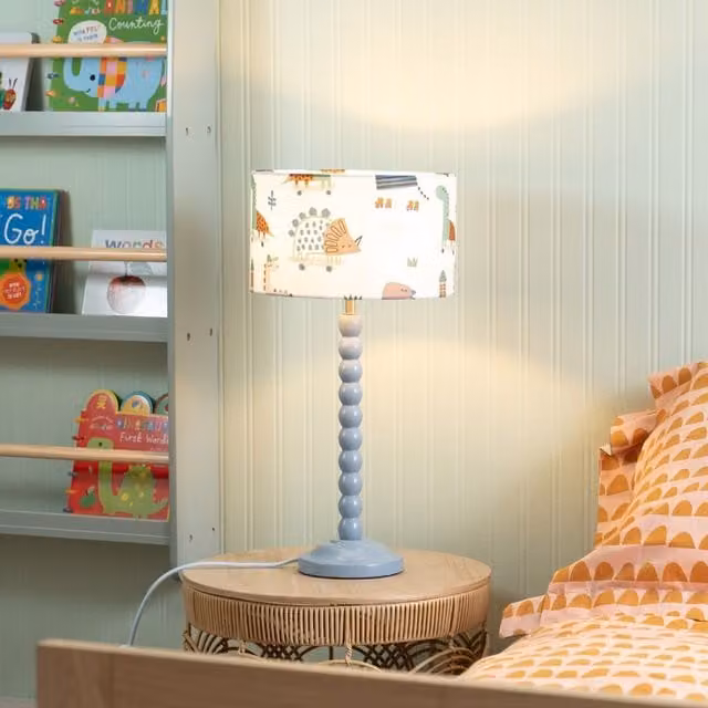 ValueLights Powder Blue Bobbin Table Lamp with Cartoon Dino Drum Shade and LED Bulb