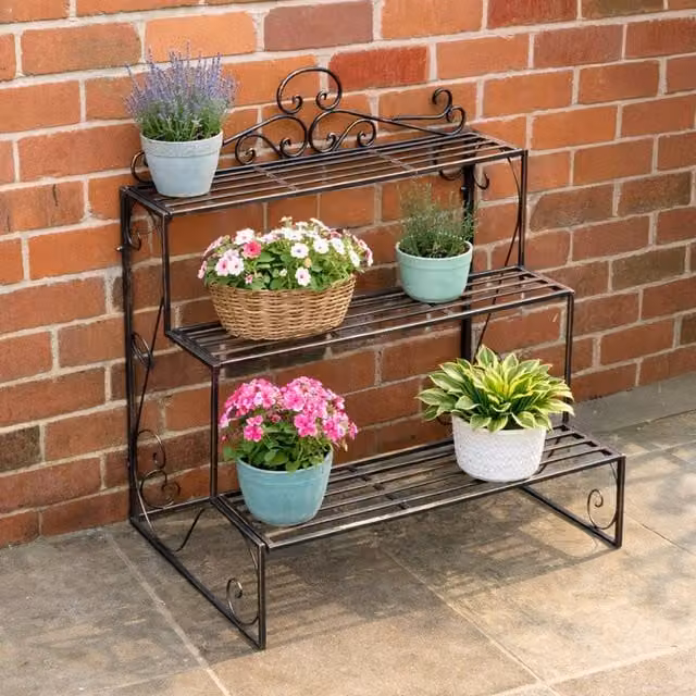 Melody Maison Black and Gold Lacquered Metal Three Tier Plant Theatre Stand