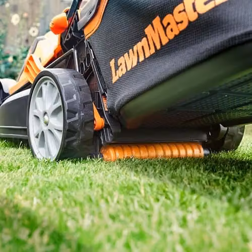LawnMaster MX 24V 34cm Cordless Lawnmower in Orange with Spare Battery, Quick Charger, Collection Bag and Mulching Kit – 3