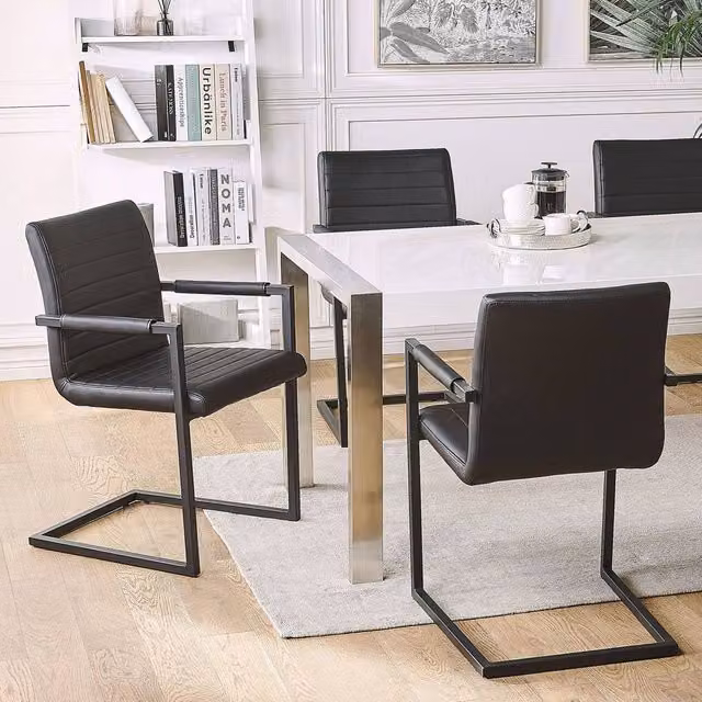 Wyld and Coco Set of 2 Black Faux Leather Cantilever Dining Chairs with Armrests