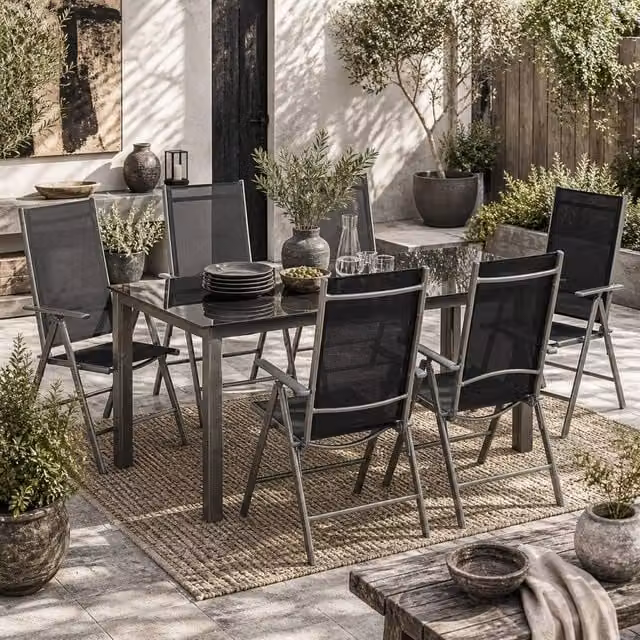 Wyld Haus Lule 6 Seater Black Powder Coated Aluminium Garden Dining Set with Glass Table and Folding Chairs – 1