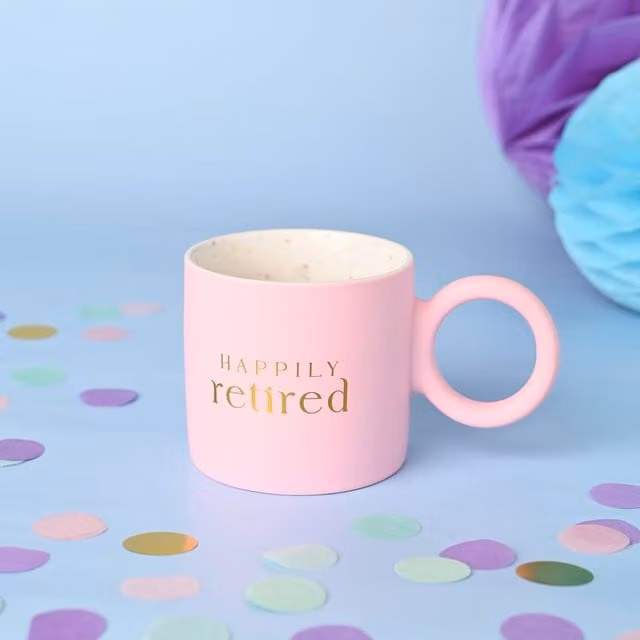 Confetti Happily Retired Pink Mug in Light Pink with Gold and Multicolour Details