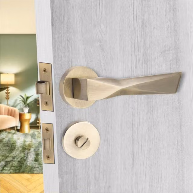 Golden Grace Aura Thumbturn and Coin Release Round Rose Door Handle in Antique Brass