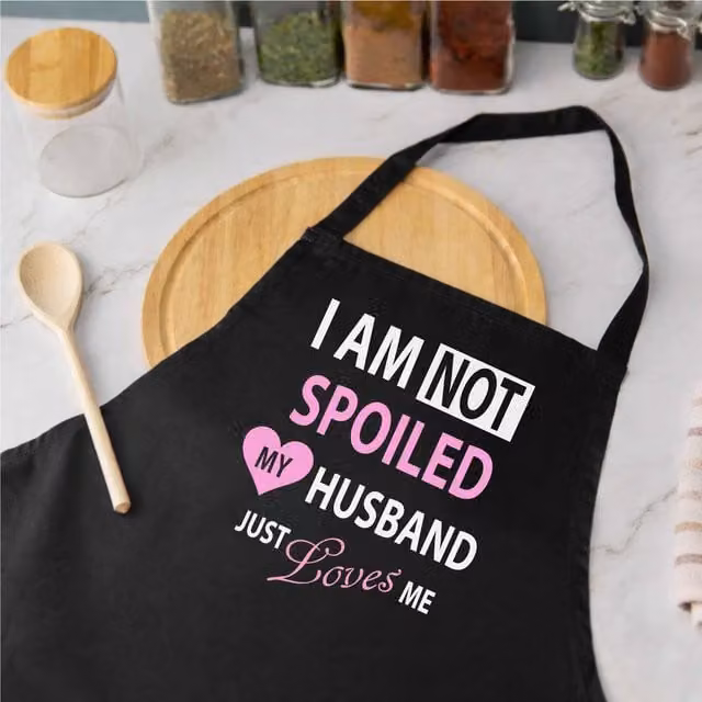 60 Second Makeover Women's I'm Not Spoiled My Husband Just Loves Me Apron in Black – 1