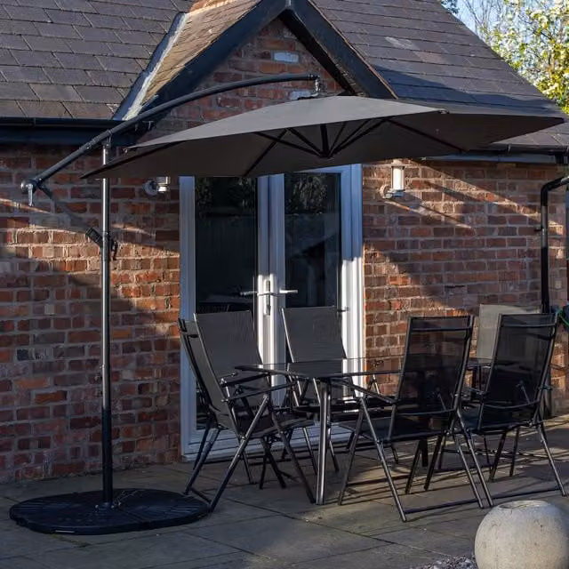 Samuel Alexander 6 Seater Glass Top Dining Set with Grey Banana Parasol and Base in Black