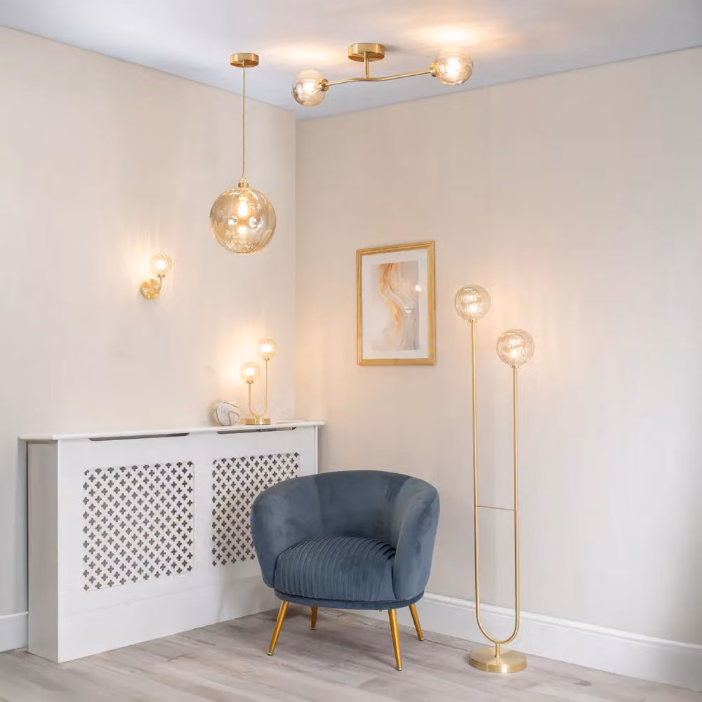 ValueLights Pair of Gold Metal Curved Stem Wall Lights with Amber Ribbed Glass Globe Shades and LED Bulbs – 2