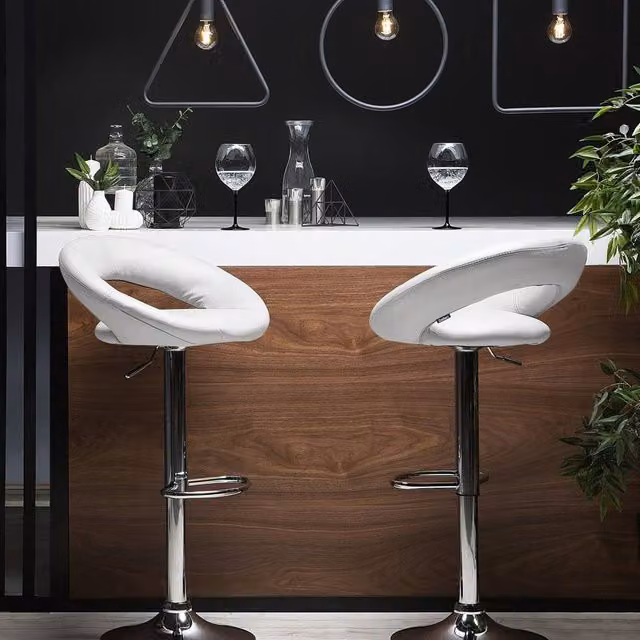 Wyld and Coco Set of 2 White Faux Leather Swivel Bar Stools with Gas Lift and Silver Metal Base