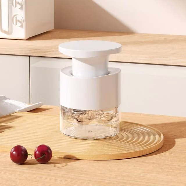 Quipulse Seven-hole Push-button Cherry Pitter in White