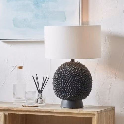 Ruma Black Ceramic Sea Urchin Table Lamp with White Handloom Cylinder Shade