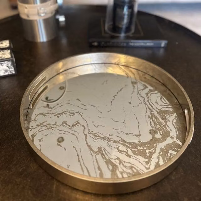 Maison Des Cadeaux Round Marbled Mirror Tray with Gold Handles in Champagne