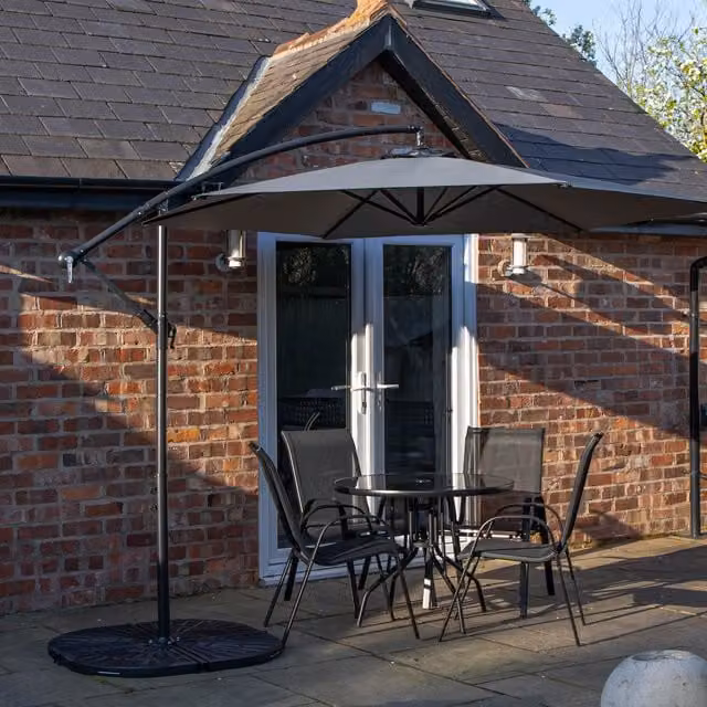 Samuel Alexander Modern 4 Person Glass Top Garden Dining Set with Grey Parasol in Black and Grey
