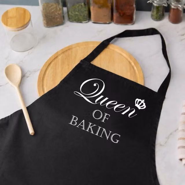 60 Second Makeover Queen Of Baking Women's Apron in Black – 1