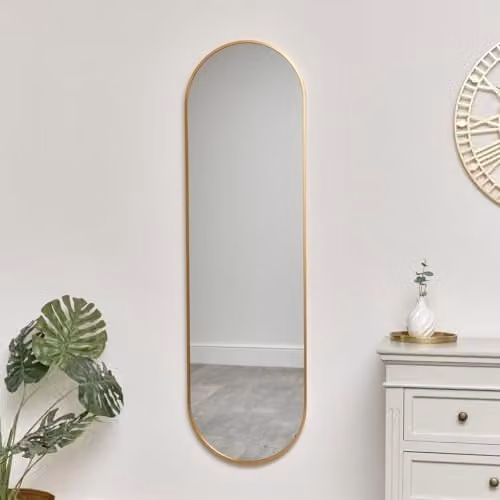 Melody Maison Modern Oval Wall Mirror in Gold, W/H: 140 x 40 cm