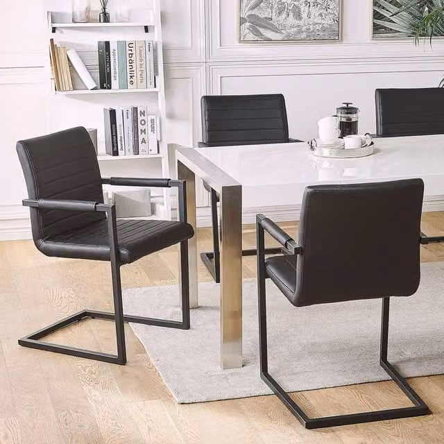 Wyld and Coco Set of 2 Black Faux Leather Cantilever Dining Chairs with Armrests – 1