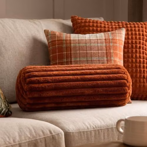 OHS Faux Fur Ribbed Round Bolster Cushion in Orange – 1
