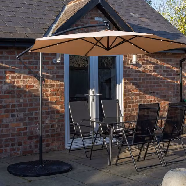 Samuel Alexander 4 Person Dining Set with Rectangular Glass Top Table, Banana Lit Parasol and Base in Beige and Black