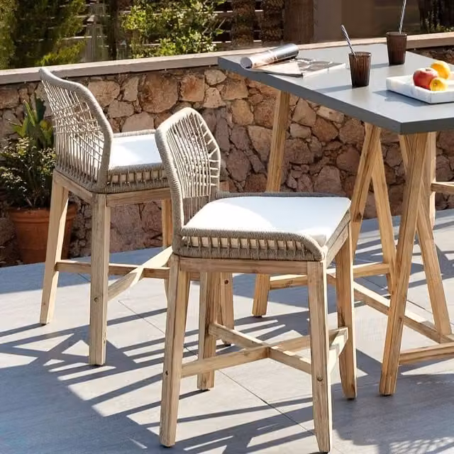 Wyld and Coco Set of 2 Boho Acacia Wood and Iron Outdoor Bar Stools in Light Brown and Beige – 1