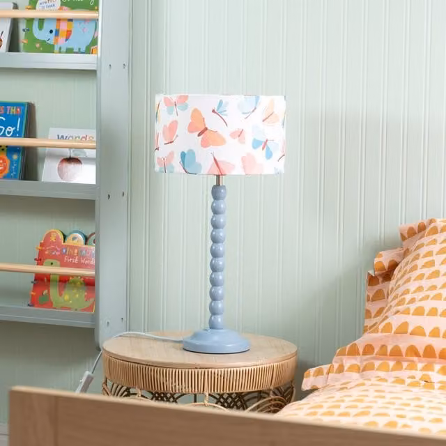 ValueLights Blue Bobbin Stem Table Lamp with Butterfly Fabric Drum Shade in Powder Blue