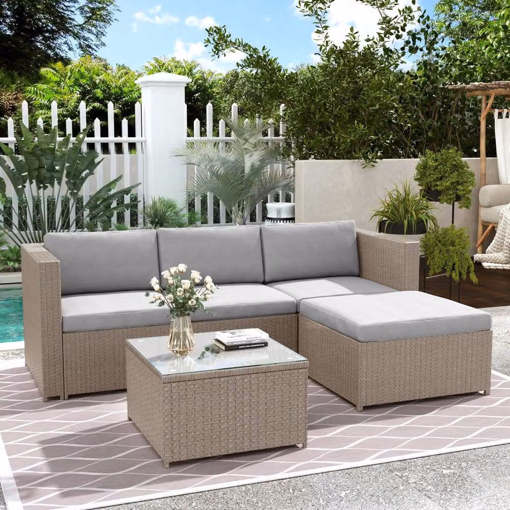 Tokpiedi Modern L-Shape Grey Polyrattan Outdoor Furniture Set with 2-Seater Sofa, Coffee Table, Ottoman and Upholstered Cushions – 2
