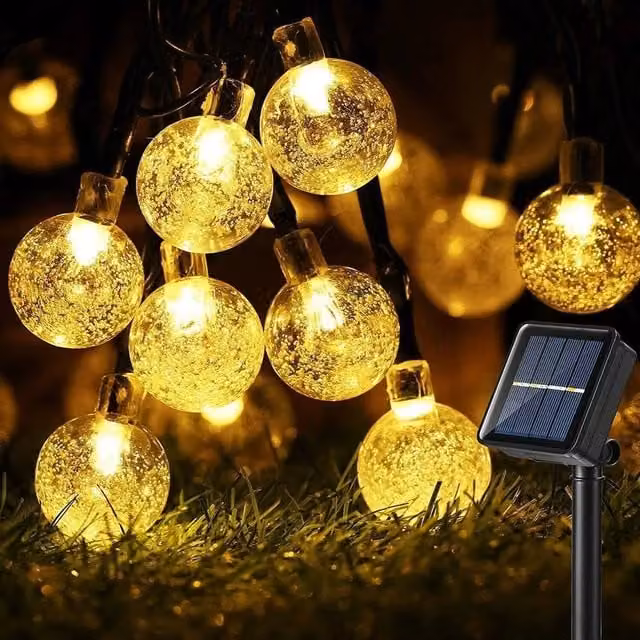 FLAVORA 50 LED Solar Warm White Globe String Lights with Transparent Glass Balls
