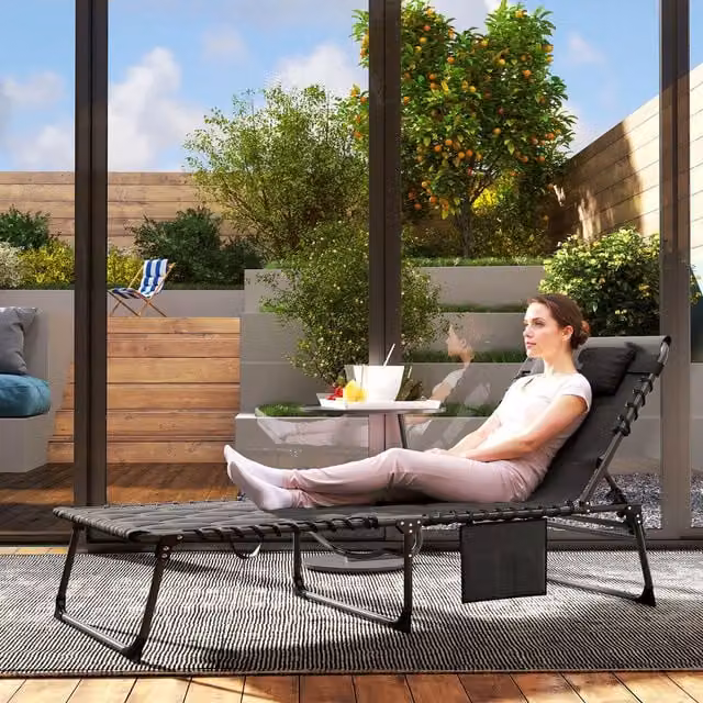 Outsunny Foldable Metal Frame Padded Sun Lounger in Black with Adjustable Headrest