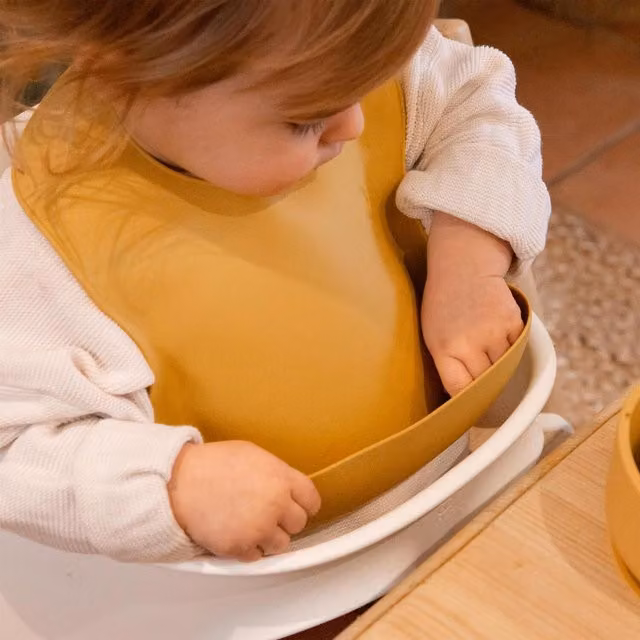 Tiny Dining Reusable Silicone Baby Crumb Catcher Bib in Yellow