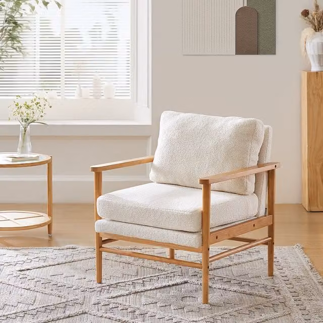 Komore Modern White Bouclé Fabric Lounge Armchair with Armrests and Wood Details