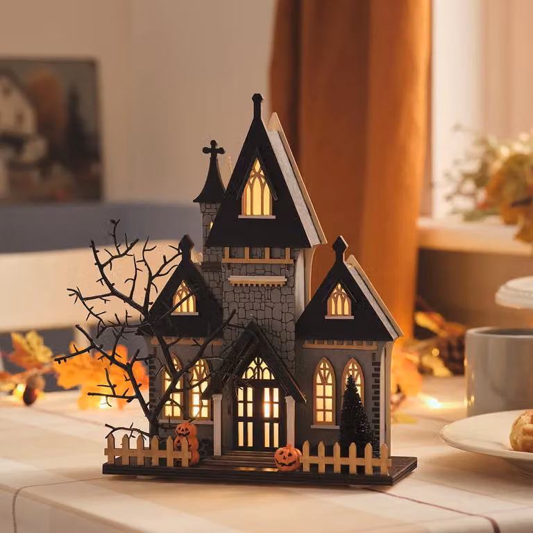 Lights4fun Spooky LED Wooden Halloween House Decoration in White and Multicolour