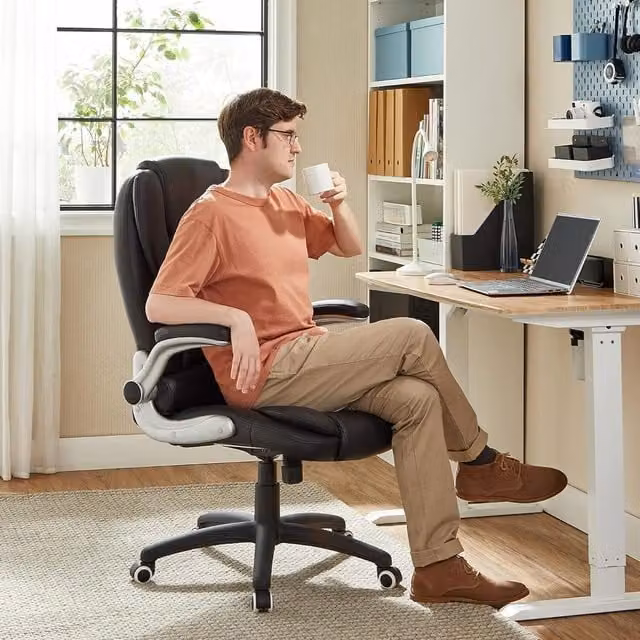 SONGMICS Executive Swivel Chair with Armrests and Headrest in Black Synthetic Leather