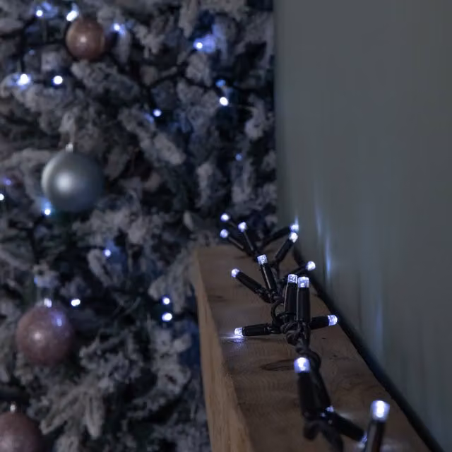 Samuel Alexander Connectable Christmas LED String Lights with 300 White LEDs in Black