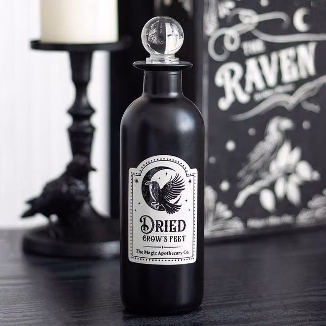 Uniqueful Black Decorative Glass Potion Bottle with Dried Crow's Feet for Halloween Tabletop Decor