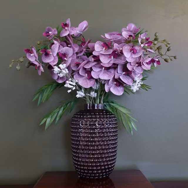 Amethyst Artificial Purple Orchid and Leaf Arrangement in a Round Geometric Glass Vase
