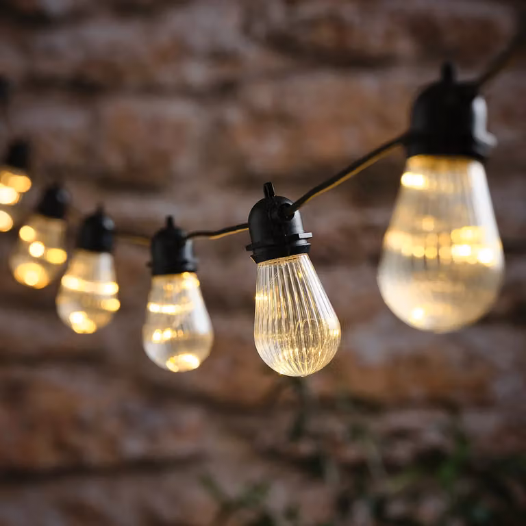 Lights4fun 10 Fluted LED Outdoor Battery Micro Festoon Lights with Timer in Black and Transparent Warm White Glass