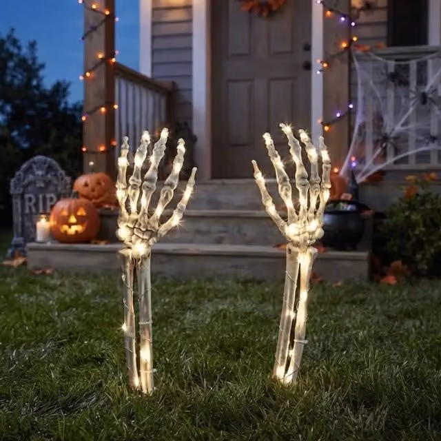 Garden Greatness Spooky LED Light Up Skeleton Arms Halloween Garden Stake in White and Multicolour