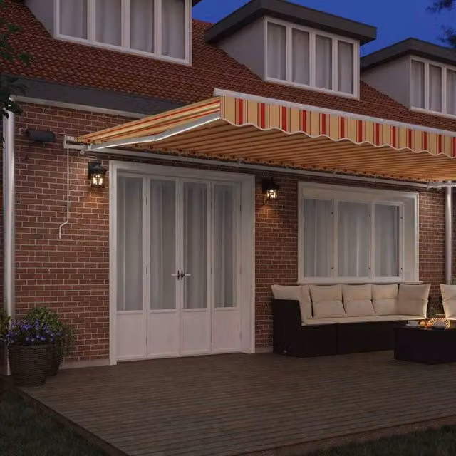 Berkfield Home Manual Retractable Polyester Awning with LED in Yellow and Orange Striped, W: 600 cm, D: 300 cm