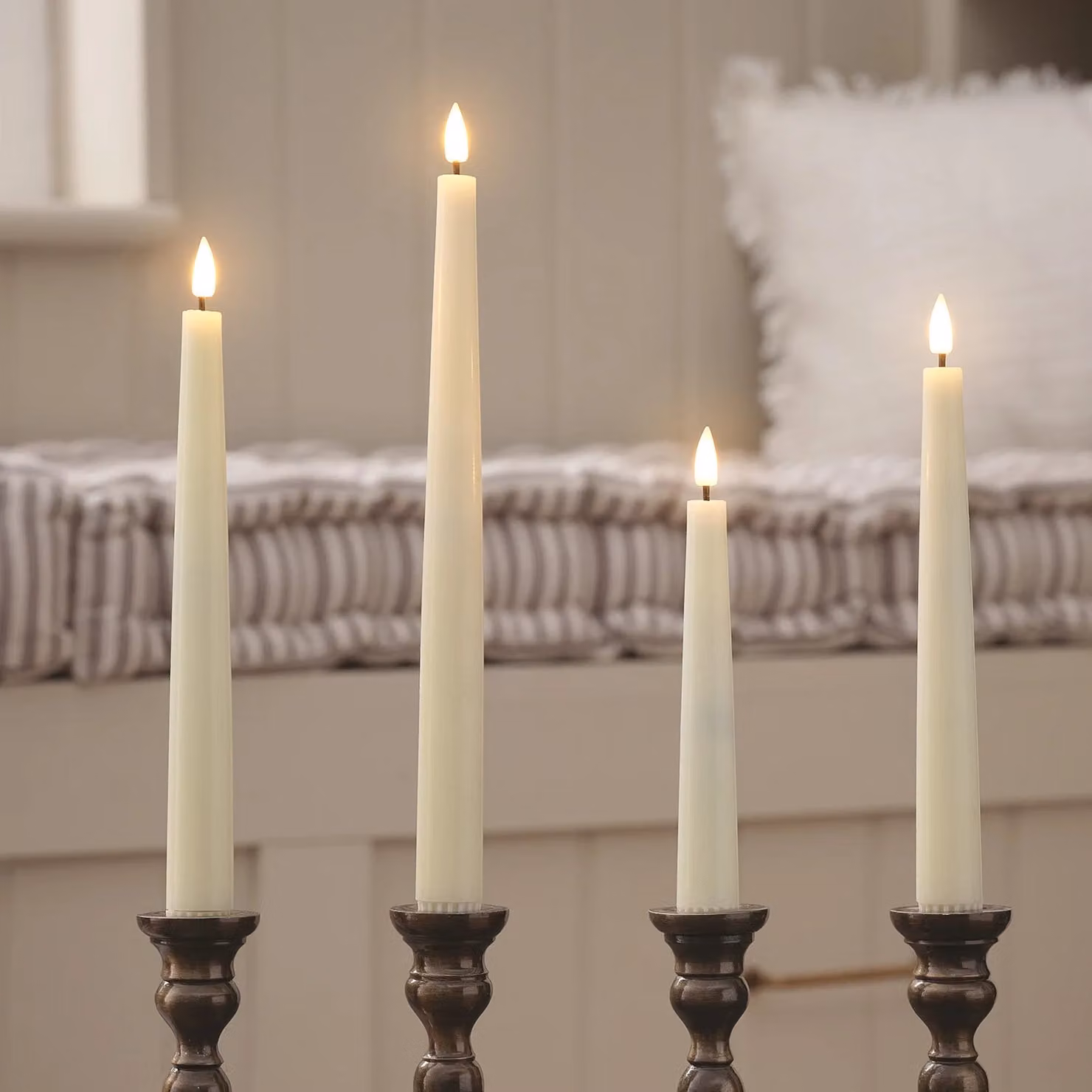 Lights4fun Set of 4 Ivory TruGlow Mixed Height LED Taper Dinner Candles with Remote Control and Timer