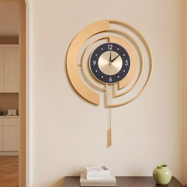 Komore 18-Inch Minimalist Round Quartz Wall Clock with Pendulum in Gold and Black