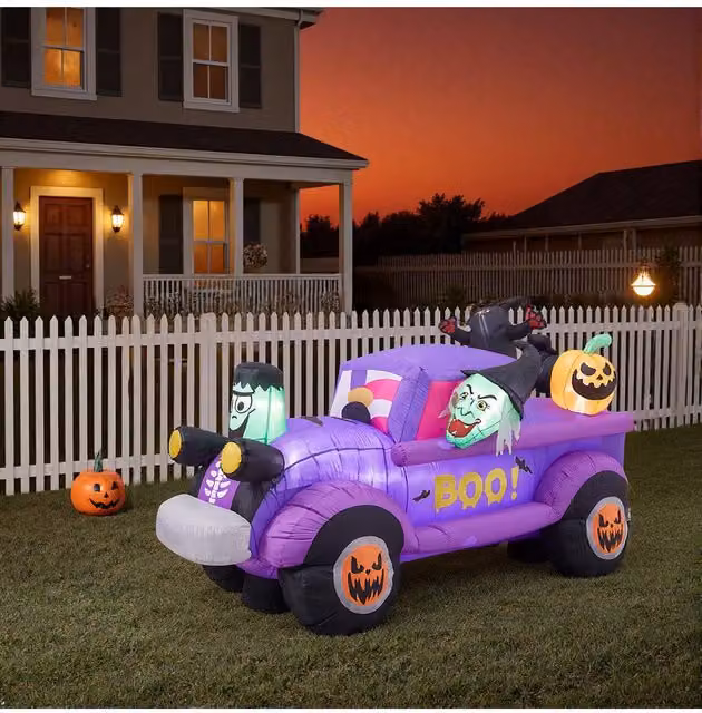 Garden Sanctuary 5ft Halloween Inflatable Witch Car with Jack-o'-lantern LEDs in Purple, Height: 152.4 cm – 1