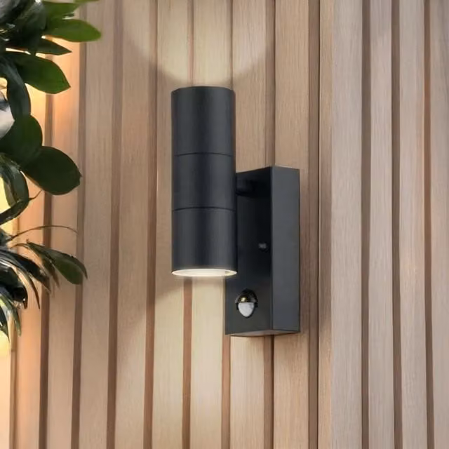 First Choice Lighting Blaze Black Outdoor Up Down Motion Sensor Wall Light with Glass and Metal Finish
