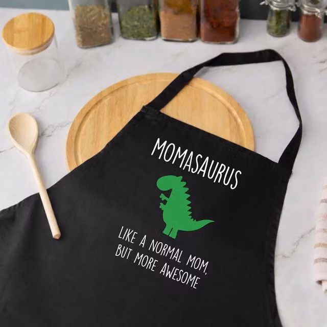 60 Second Makeover Women's Momasaurus Dinosaur Apron in Black – 1
