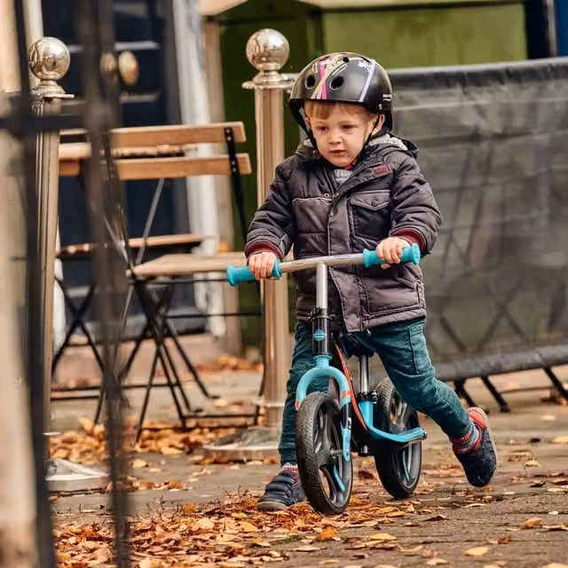 Ride-ezy Black and Green Balance Bike with Height Adjustment and Light and Sound Features